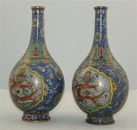 A pair of Chinese cloisonne enamel dragon bottle vases, early 20th century, 25.5cm